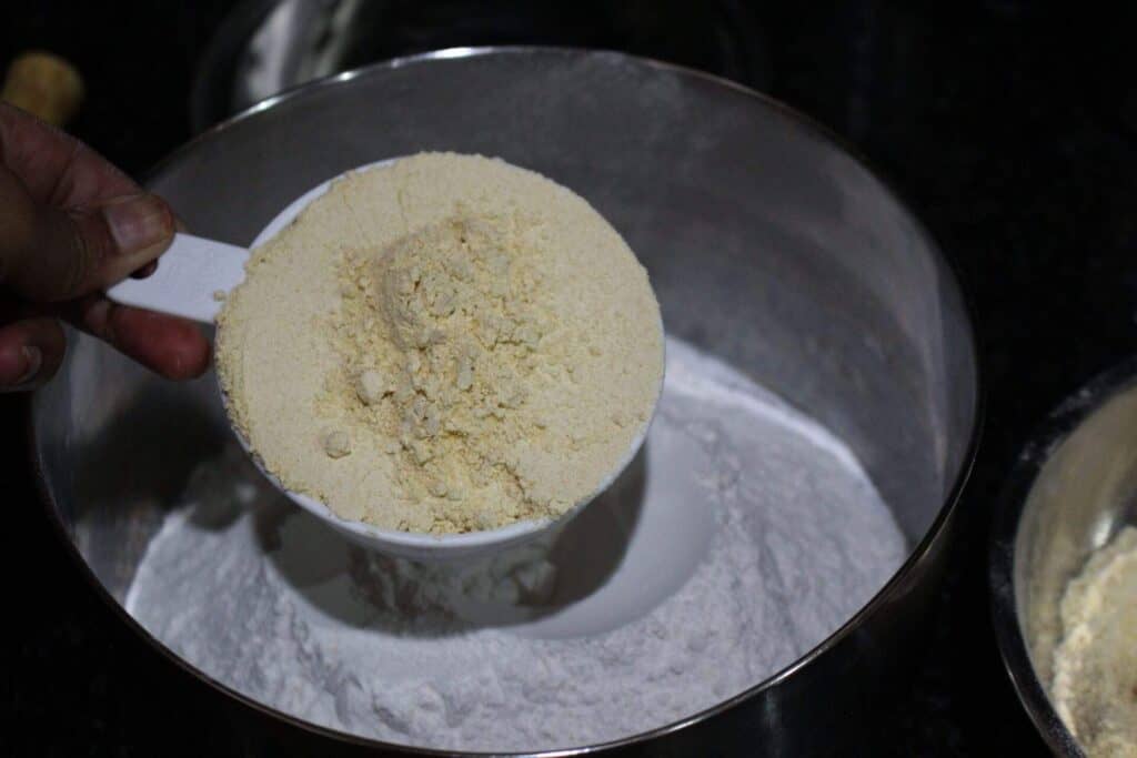Measuring out lentil flour for murukku