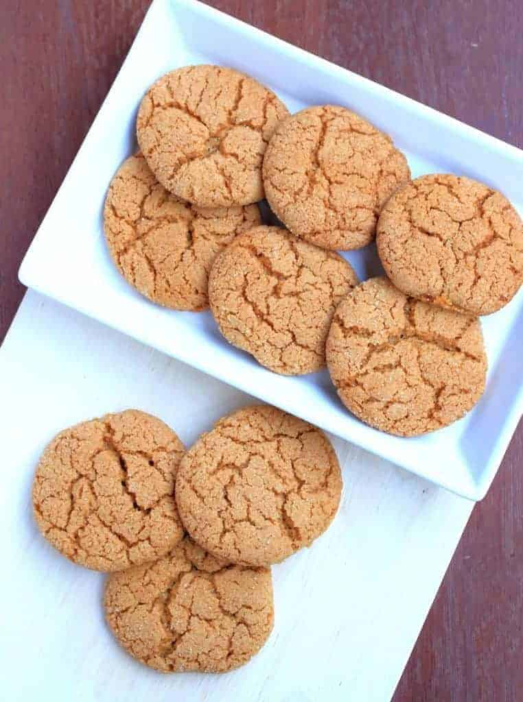 Ginger Cookies in a plate and 3 cookies on a board
