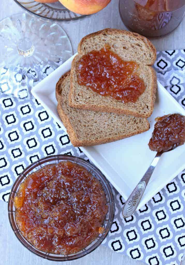 apple jam in a  bowl and on bread
