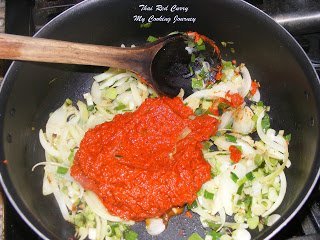 adding red curry paste