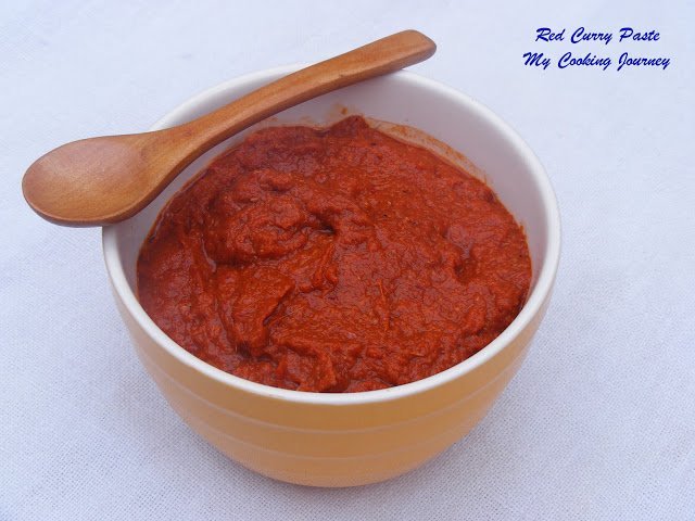 Thai Red Curry paste in a bowl with wooden spoon