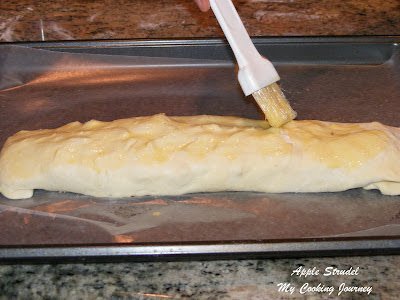 Brushing pastry sheet with egg wash