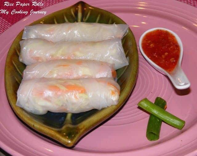 Rice paper rolls in a tray with chutney