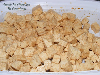 Cut tofu in a bowl marinating