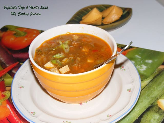 vegetable tofu and noodle soup in a Bowl with plate