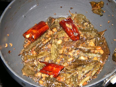 Frying spices in a pan