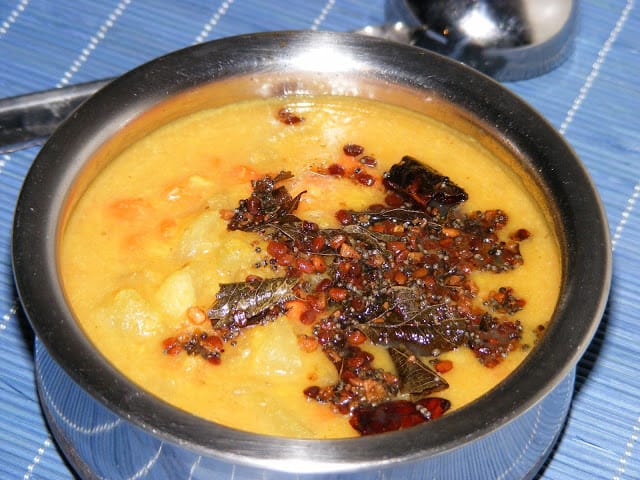 Adding fried spice on top of chow-chow carrot kootu