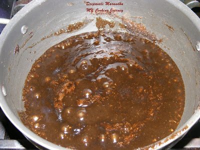 Adding ghee in mixture.