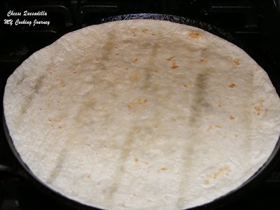 Heating the tortilla in a pan