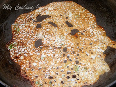 cooking Dosai  on a  pan