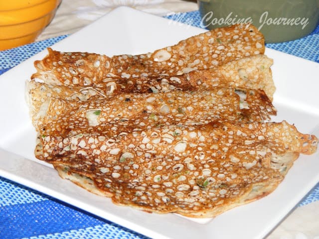 four Rava Dosai  served in a plate