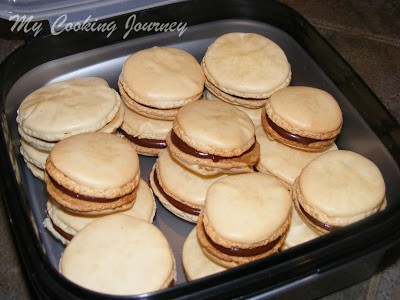 French Macarons with Chocolate Ganache in a tray