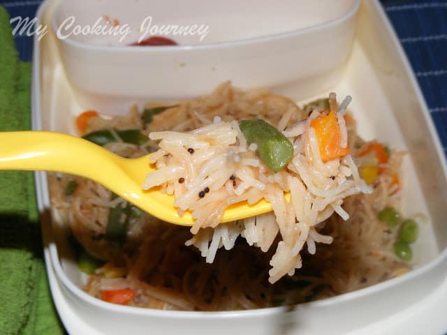 Semiya upma scooped in a fork