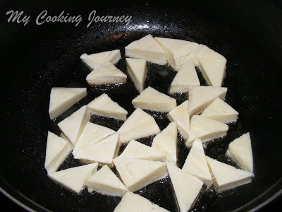 frying paneer in a Pan