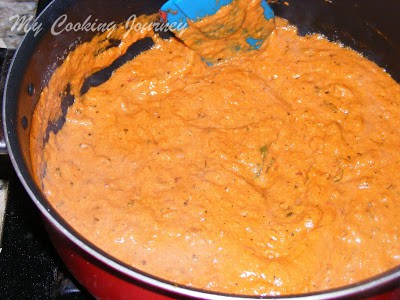 Cooking the shahi paneer in a pan