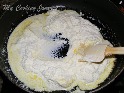Mixing and cooking the ingredients in pan.