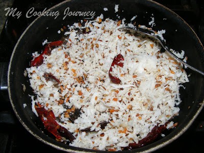 Fry red chilies, cumin seeds and ullutham paruppu with coconut