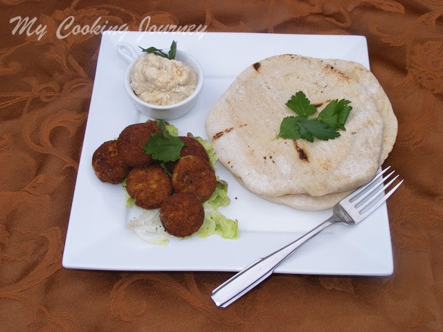 Falafel garnish with cilantro serve in a plate