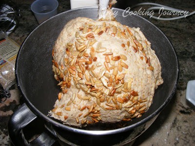 Mixing pumpkin seed in the dough