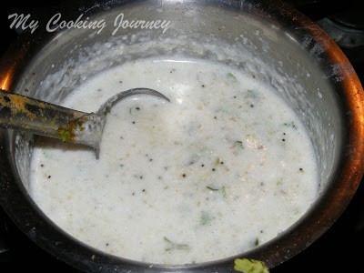 Mixing rice and water with vegetables and cooking