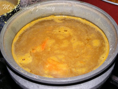 Pineapple rasam in a pot