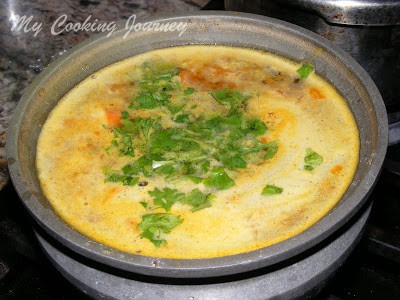 Pineapple rasam with some coriander 