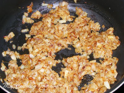 Adding garam masala and stirring the onions.