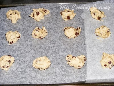 cookie batter placed on baking tray with wax paper