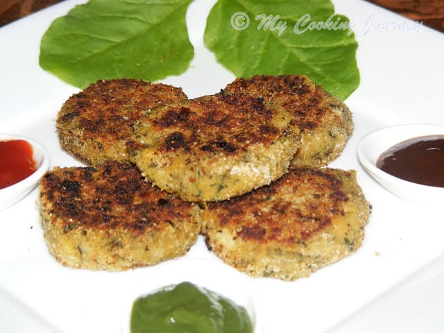 Green Cutlets garnish with spinach leaves