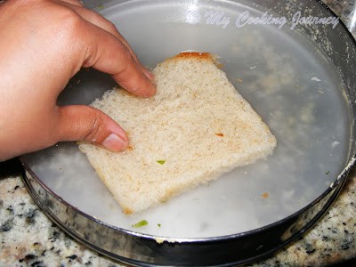 Dip the bread slices in water