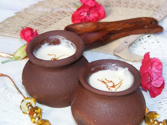 Mishti Doi topped with saffron and ready to serve.