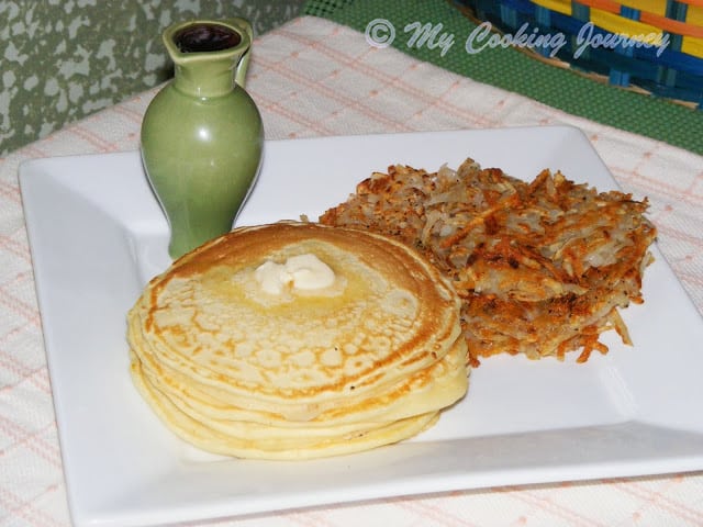 Pancakes with Hashbrowns served in a tray.