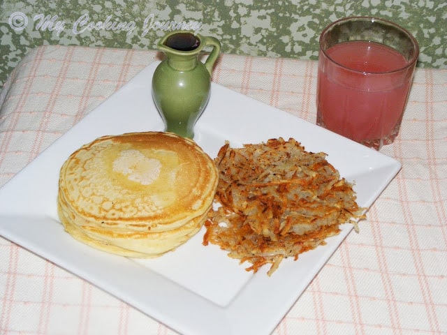 Pancakes and Hashbrowns served in a dish.