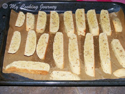 Sliced logs arranged in baking tray