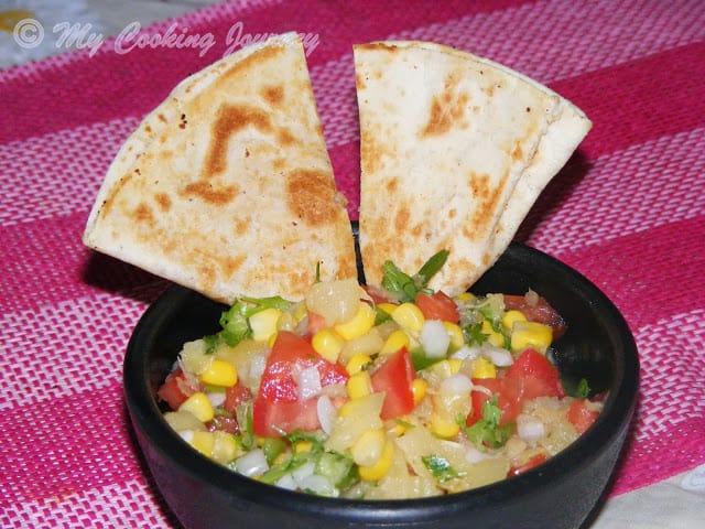 Corn Pineapple Salsa Salad in black bowl