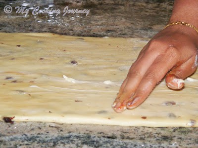 Flattned dough with softened butter