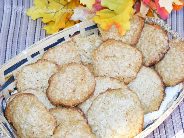 Oatmeal coconut Cookies in a basket with some decorative leaves