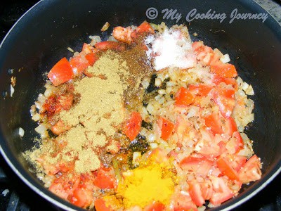 Adding tomatoes and Masala powders