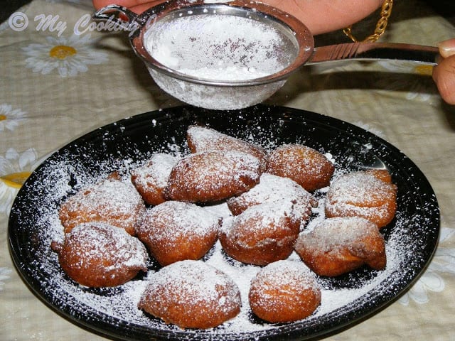 Zeppole dusted with powdered sugar