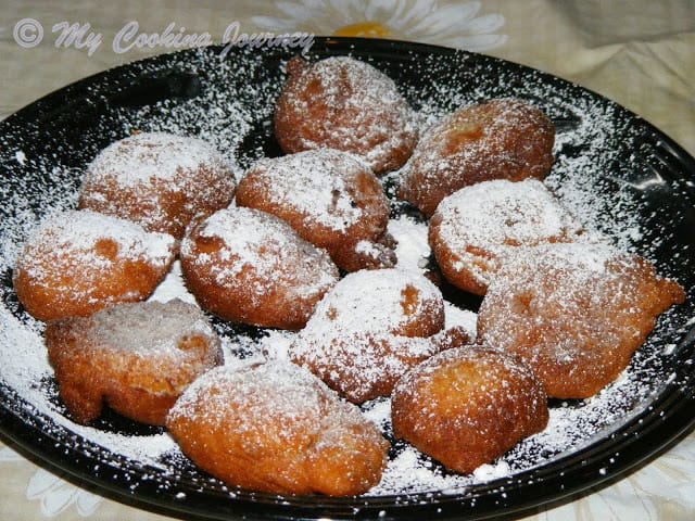 Zeppoles in a black plate