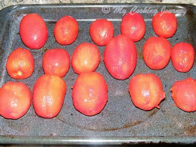 tomatoes lined on a baking tray