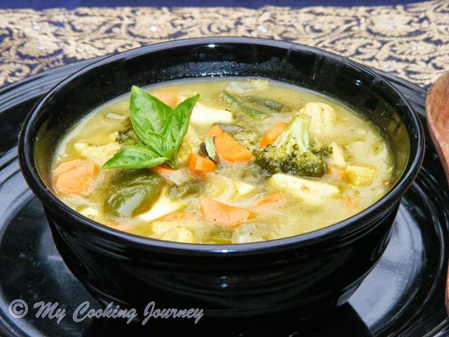 Thai Green Curry in a black bowl