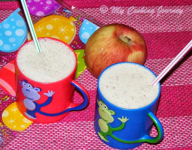 Apple Smoothie served in a cup with straw