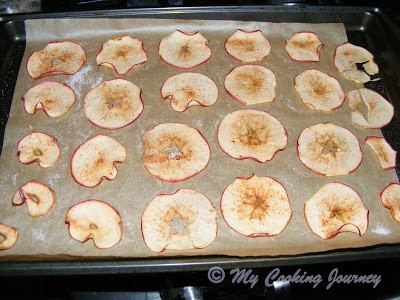 half baked apple chips in a tray