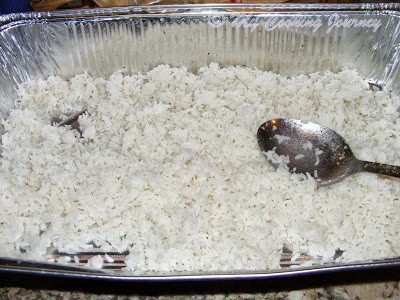 Cooked rice in a foil with spoon