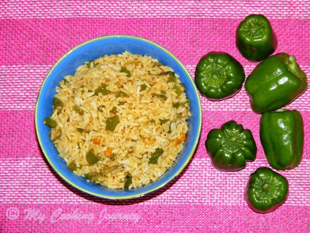 Bell pepper rice served in a bowl wiith belll paper