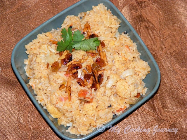 Cauliflower Dum Biriyani in a bowl garnish with cilantro