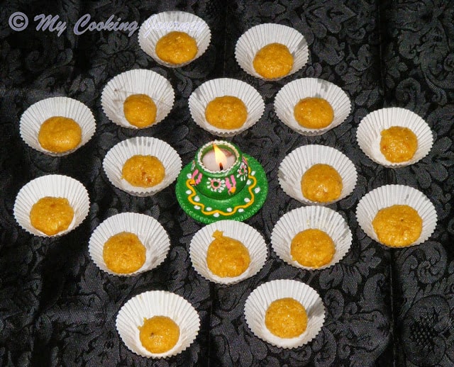 Delicious Doodh peda arranged with lamp in the middle