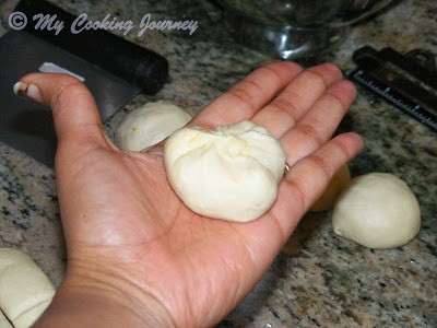 Making round ball of dough.