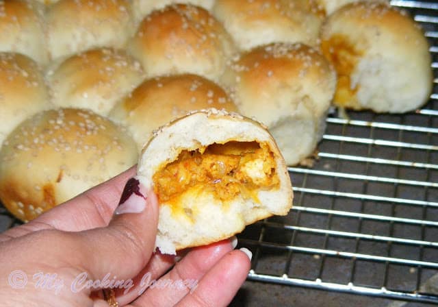 Paneer stuffed bread cut into half.